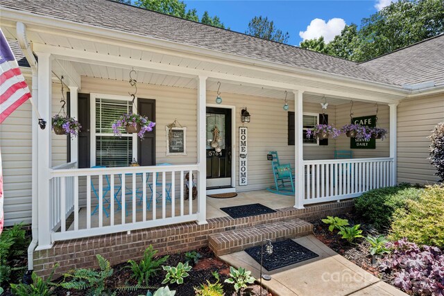 5764 Grassy Creek Rd, Denver, NC 28037 - entrance to property featuring covered porch and roof with shingles