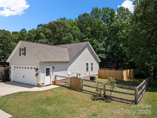 5764 Grassy Creek Rd, Denver, NC 28037 - view of front of house featuring driveway, a gate, a shingled roof, central AC, and an attached garage