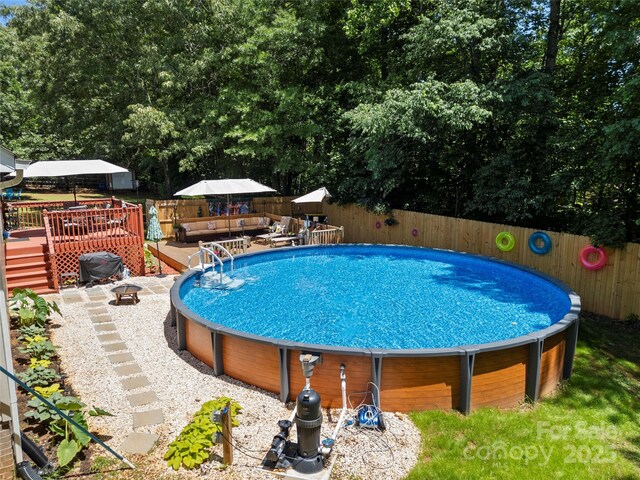 5764 Grassy Creek Rd, Denver, NC 28037 - view of swimming pool with a deck and fence