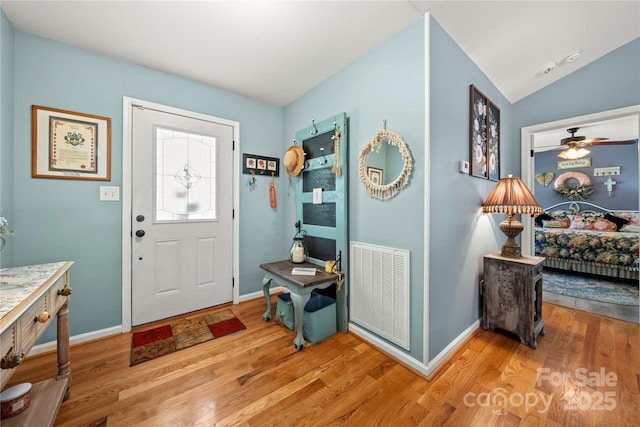 5764 Grassy Creek Rd, Denver, NC 28037 - entrance foyer with wood finished floors, baseboards, and ceiling fan