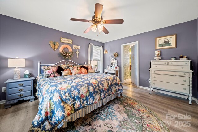 5764 Grassy Creek Rd, Denver, NC 28037 - bedroom featuring baseboards, wood finished floors, ceiling fan, and connected bathroom