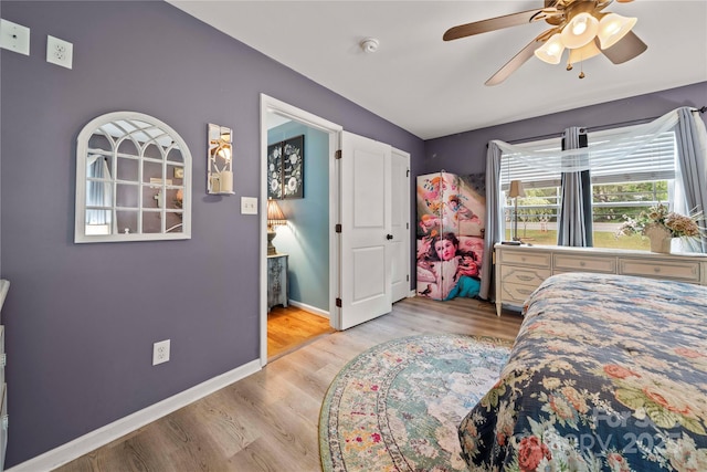 5764 Grassy Creek Rd, Denver, NC 28037 - bedroom with baseboards, wood finished floors, and ceiling fan