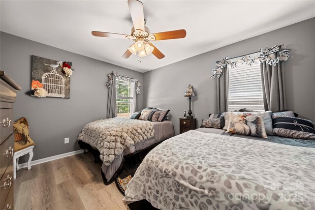 5764 Grassy Creek Rd, Denver, NC 28037 - bedroom featuring wood finished floors, ceiling fan, and baseboards