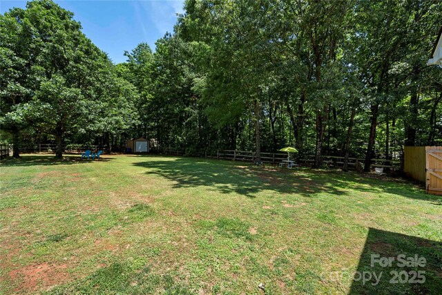 5764 Grassy Creek Rd, Denver, NC 28037 - view of yard featuring a storage shed and an outdoor structure