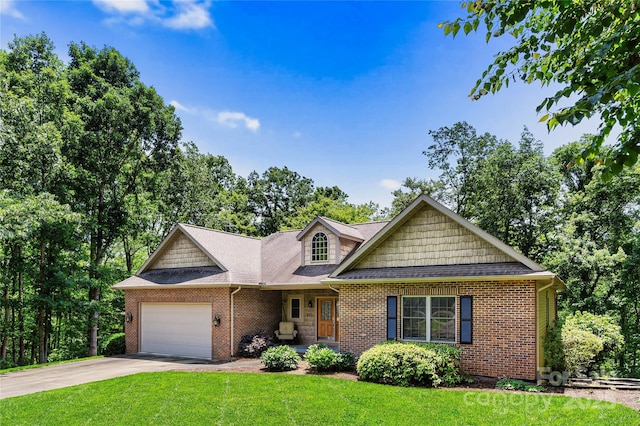 view of front of home featuring an attached garage, a front yard, brick siding, and driveway