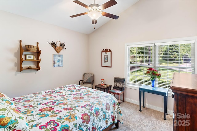 bedroom with vaulted ceiling, carpet floors, baseboards, and ceiling fan