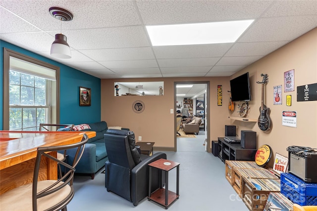 living room featuring a drop ceiling