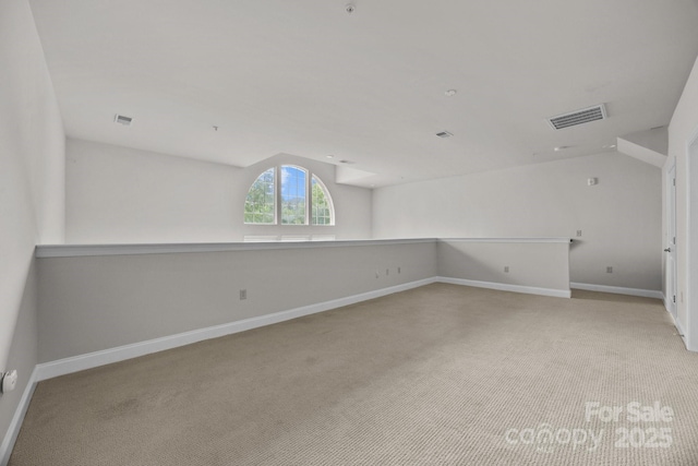 120F Steinbeck Way, Mooresville, NC 28117 - empty room featuring vaulted ceiling, carpet flooring, and baseboards