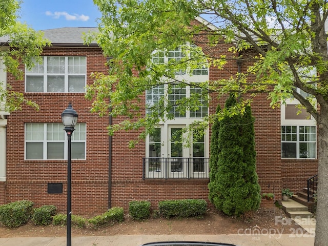 120F Steinbeck Way, Mooresville, NC 28117 - view of side of home featuring french doors and brick siding
