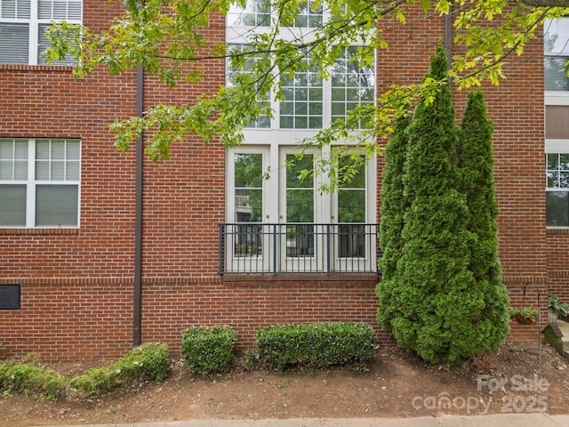 120F Steinbeck Way, Mooresville, NC 28117 - view of property exterior with french doors and brick siding