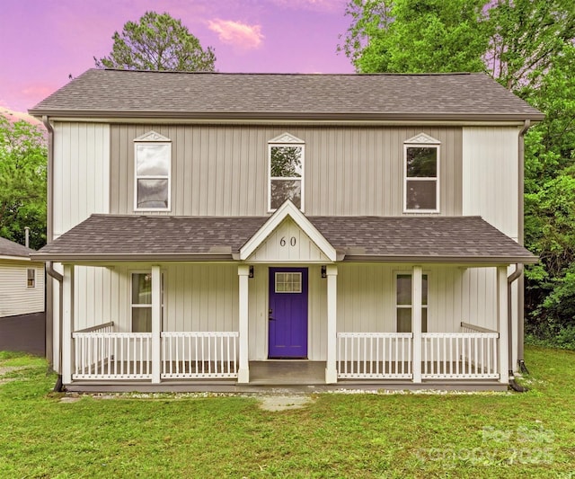 60 Valley St NW, Concord, NC 28025 - view of front of house with a porch, a front lawn, and a shingled roof
