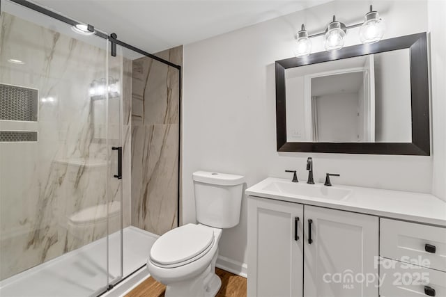60 Valley St NW, Concord, NC 28025 - full bathroom with toilet, vanity, a marble finish shower, and wood finished floors