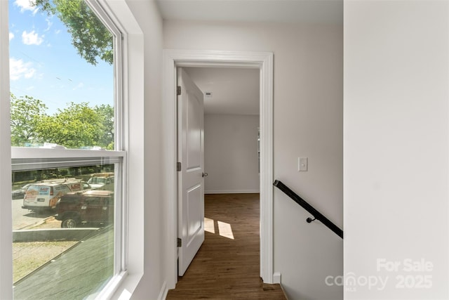 60 Valley St NW, Concord, NC 28025 - hallway featuring dark wood-type flooring, healthy amount of natural light, baseboards, and an upstairs landing