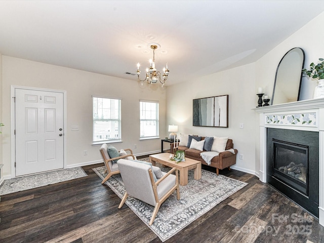 134 Kerri Dawn Ln Unit 117, Locust, NC 28097 - living room with dark wood finished floors, a chandelier, a glass covered fireplace, and baseboards