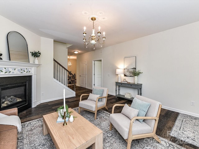 134 Kerri Dawn Ln Unit 117, Locust, NC 28097 - living area with stairs, a chandelier, wood finished floors, baseboards, and a glass covered fireplace