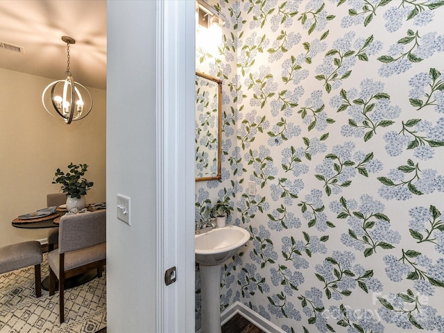 134 Kerri Dawn Ln Unit 117, Locust, NC 28097 - bathroom featuring a chandelier and baseboards