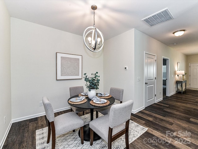134 Kerri Dawn Ln Unit 117, Locust, NC 28097 - dining room with a chandelier, baseboards, and dark wood-type flooring
