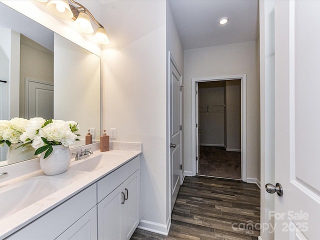 134 Kerri Dawn Ln Unit 117, Locust, NC 28097 - full bathroom with double vanity, wood finished floors, a closet, baseboards, and recessed lighting