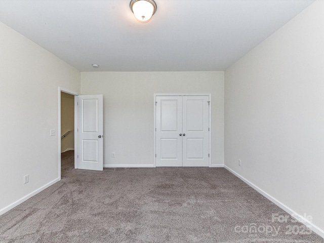 134 Kerri Dawn Ln Unit 117, Locust, NC 28097 - unfurnished bedroom with carpet, baseboards, and a closet