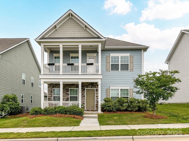 134 Kerri Dawn Ln Unit 117, Locust, NC 28097 - view of front of property with covered porch, a balcony, a front yard, and central AC