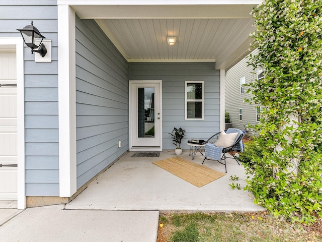 134 Kerri Dawn Ln Unit 117, Locust, NC 28097 - view of exterior entry with a patio and a garage
