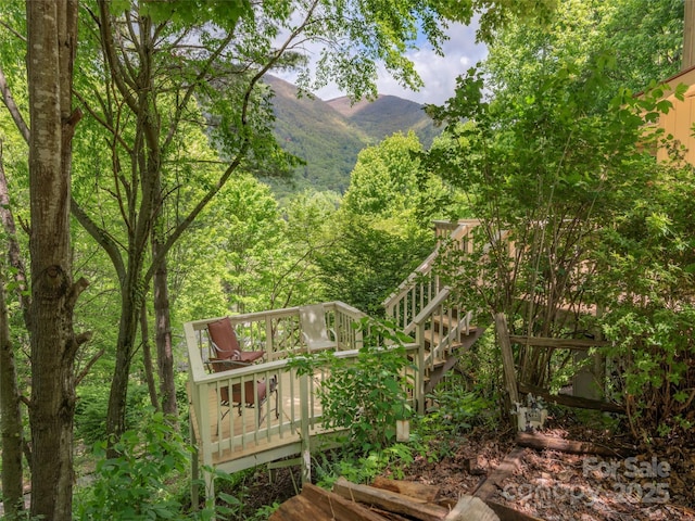 227 Soco Acres Rd, Maggie Valley, NC 28751 - view of home's community with a deck with mountain view, stairs, and a view of trees