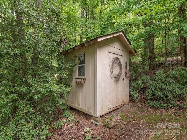 227 Soco Acres Rd, Maggie Valley, NC 28751 - view of shed featuring a wooded view