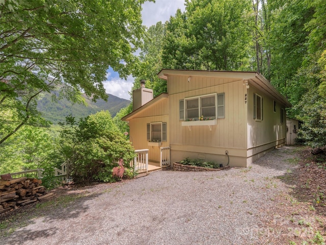 227 Soco Acres Rd, Maggie Valley, NC 28751 - view of front of house with a chimney and a mountain view