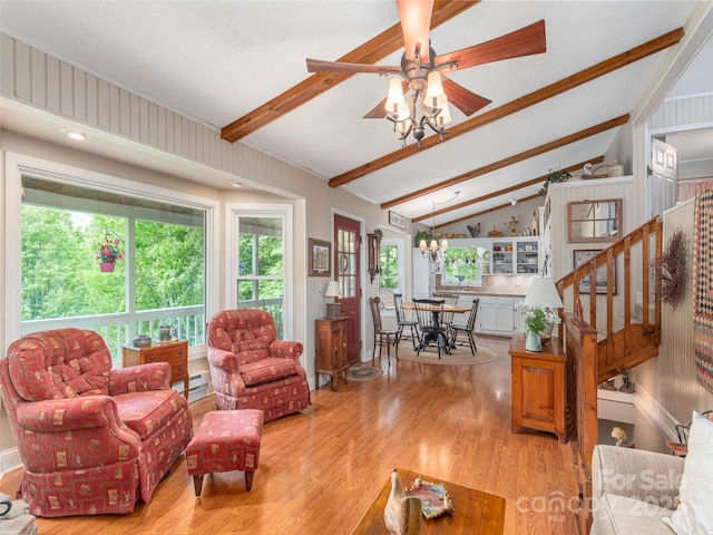 227 Soco Acres Rd, Maggie Valley, NC 28751 - living area with wood finished floors, ceiling fan, stairs, and a baseboard radiator