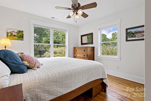 24 Browndale Rd, Asheville, NC 28805 - bedroom with baseboards, wood finished floors, and a ceiling fan