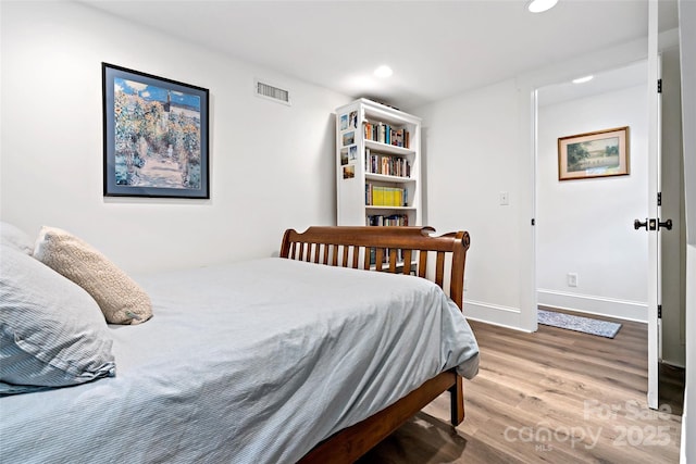 24 Browndale Rd, Asheville, NC 28805 - bedroom with wood finished floors, recessed lighting, and baseboards
