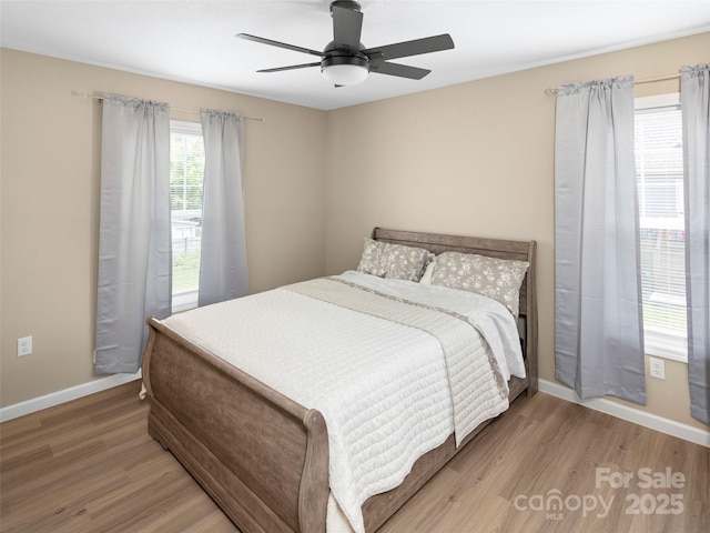 87 Markley Dr, Flat Rock, NC 28731 - bedroom with wood finished floors, baseboards, and ceiling fan