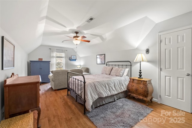 3115 Duck Point Dr, Monroe, NC 28110 - bedroom with wood finished floors, lofted ceiling, and a ceiling fan
