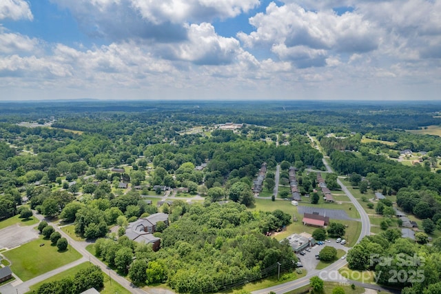 drone / aerial view of a heavily wooded area