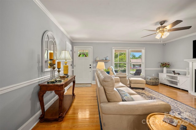 136 Coventry Ln, Forest City, NC 28043 - living area featuring light wood finished floors, crown molding, a ceiling fan, and baseboards