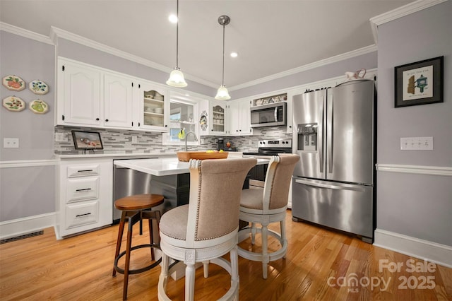 136 Coventry Ln, Forest City, NC 28043 - kitchen featuring stainless steel appliances, decorative backsplash, white cabinetry, glass insert cabinets, and ornamental molding