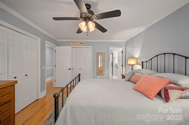 136 Coventry Ln, Forest City, NC 28043 - bedroom featuring multiple closets, light wood-type flooring, crown molding, and a ceiling fan