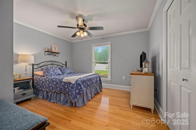136 Coventry Ln, Forest City, NC 28043 - bedroom with wood finished floors, a closet, ornamental molding, and baseboards