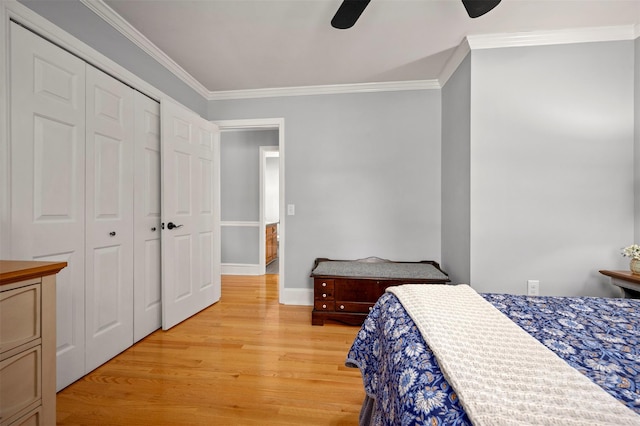 136 Coventry Ln, Forest City, NC 28043 - bedroom featuring light wood-style floors, crown molding, baseboards, ceiling fan, and a closet
