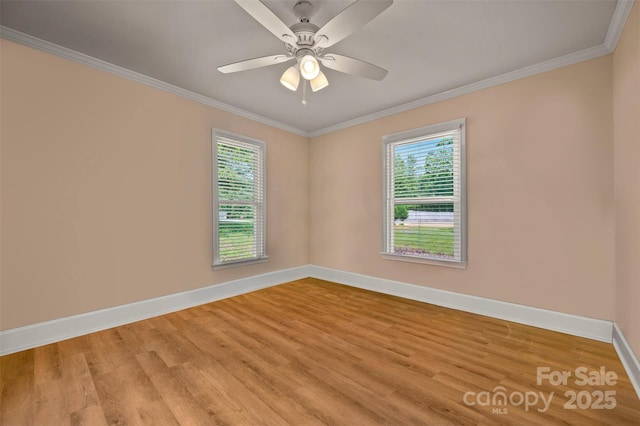 136 Coventry Ln, Forest City, NC 28043 - unfurnished room featuring healthy amount of natural light, baseboards, light wood finished floors, and crown molding