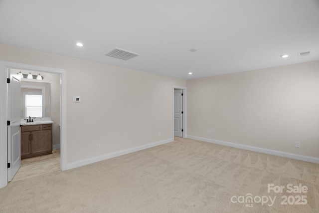 7332 Jolly Brook Dr, Charlotte, NC 28215 - spare room featuring a sink, light carpet, recessed lighting, and baseboards