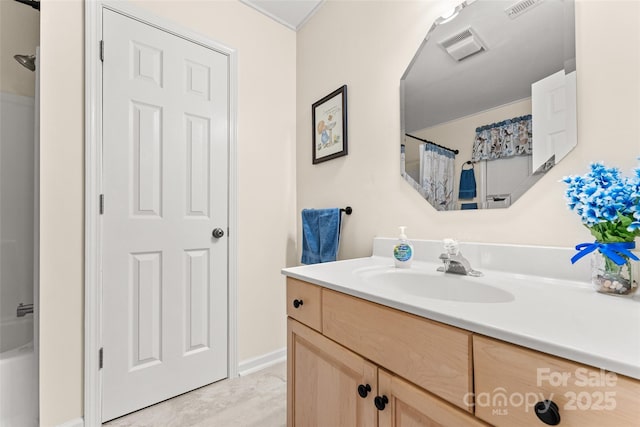 bathroom featuring a shower with curtain, vanity, and baseboards