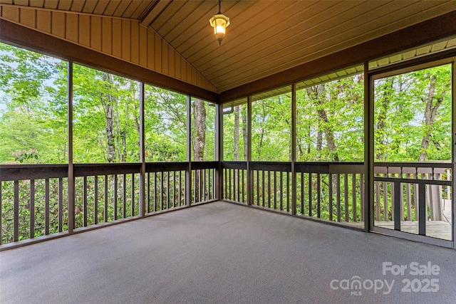 unfurnished sunroom with vaulted ceiling