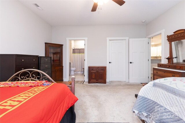 138 Foxden Dr Unit 102, Fletcher, NC 28732 - carpeted bedroom featuring ensuite bathroom and ceiling fan