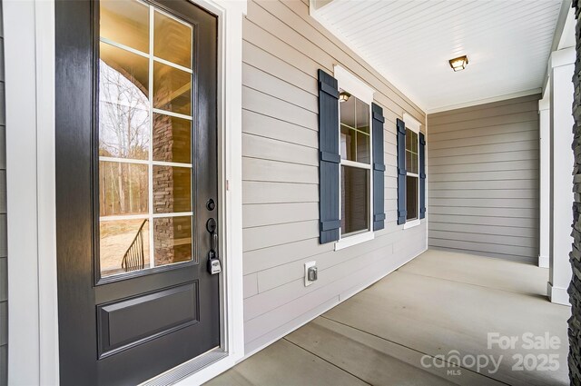 7517 Lancaster Hwy Unit 5, Waxhaw, NC 28173 - view of exterior entry featuring a porch