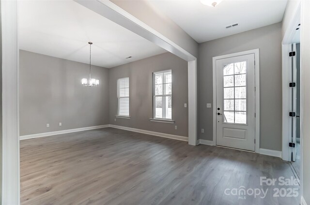 7517 Lancaster Hwy Unit 5, Waxhaw, NC 28173 - entryway featuring a chandelier, wood finished floors, and baseboards