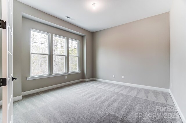 7517 Lancaster Hwy Unit 5, Waxhaw, NC 28173 - spare room featuring carpet floors and baseboards