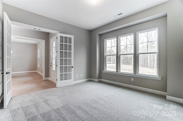 7517 Lancaster Hwy Unit 5, Waxhaw, NC 28173 - carpeted spare room featuring french doors, healthy amount of natural light, and baseboards