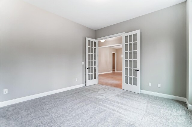 7517 Lancaster Hwy Unit 5, Waxhaw, NC 28173 - carpeted empty room with french doors and baseboards