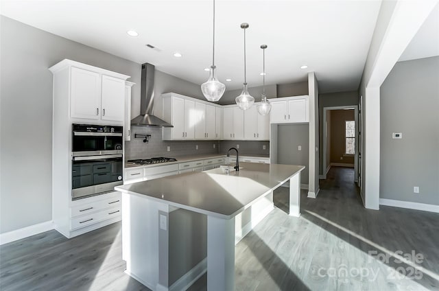 7517 Lancaster Hwy Unit 5, Waxhaw, NC 28173 - kitchen with wall chimney range hood, a sink, stainless steel appliances, baseboards, and recessed lighting
